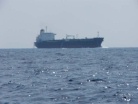 Ship flushing its holds at sea