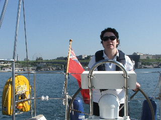 Bubby at the helm of Light Blue leaving Plymouth Sound