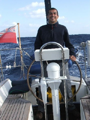 Adam at the helm and on watch in the Atlantic